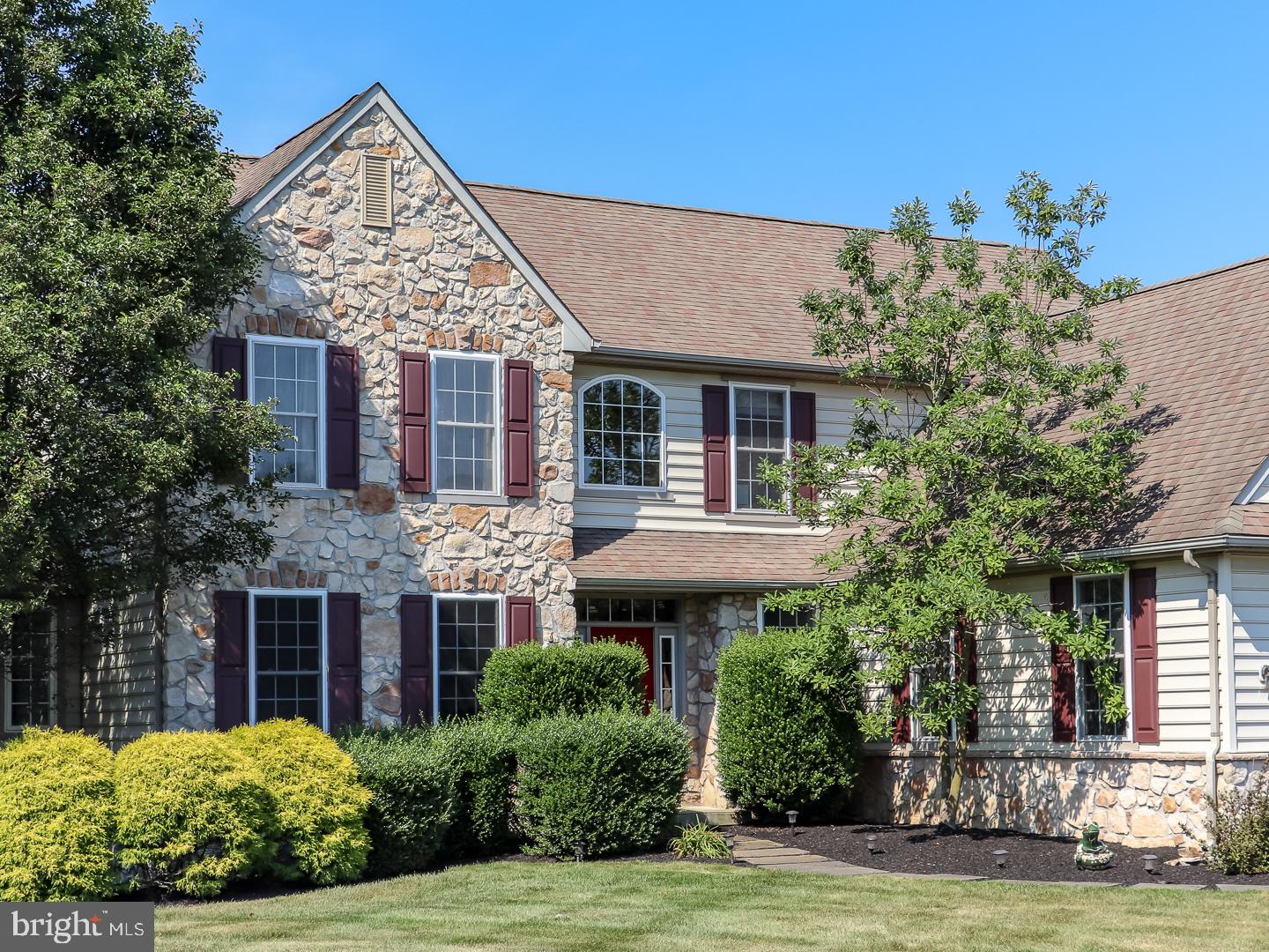 Welcome home to this beautifully upgraded 5 bedroom, 4.5 bath home in Hartefeld, one of the area's premier golf communities. Offering an open floor plan, first floor master suite, huge finished basement, new carpets, all with private rear lot and open space privacy to one side, this home is not to be missed! Welcomed in by a cozy front entrance and greeted inside by beautiful hardwood floors, dramatic staircase and wide foyer,  the home opens up to a generous living space with 2-story family room bathed in light from a dramatic wall of windows.  The cozy gas or wood fireplace and built in cabinets are situated just off the kitchen with an easy living feel, perfect for family or entertaining.  The kitchen has an open concept with huge eating area overlooking the wooded rear yard, plenty of 42" cabinets, granite counter tops, stainless steel appliances (French door refrigerator, double oven, built in microwave, dishwasher), kitchen desk area, butler's pantry, and huge seated island.  Just beyond kitchen you will find a first floor laundry and mudroom area. The private first floor master suite features a vaulted ceiling, 2 large walk in closets and updated master bath with soaking tub, his and her vanities and stall shower. The second level provides a large bedroom with en suite bath and two additional bedrooms that share a Jack and Jill bath. The finished walk out basement provides 2 additional living spaces, a large bedroom with large closet and lots of full sized windows, full bathroom, and small home office. The large maintenance free deck is private, with wooded area beyond, perfect for relaxation or hosting friends for dinner. This home is easy living at it's best - great entertaining, perfect for a family or extended family, and is close to shopping, commuter routes, and your next round of golf.  Make your appointment today ? this home has it all!