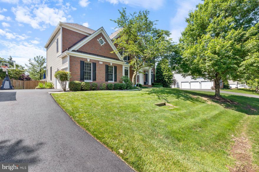 New Price! Same amazing home, even better value! Grand Living in Loudoun County’s Ashburn Station Community.  You’ll want to hurry on this spectacular home with 4 bedrooms and 4.5 baths featuring 5,073 finished square feet of classic elegance blended with modern functionality and a sprawling resort-like exterior that makes daily living feel like a vacation. Several recent upgrades and improvements enhance the comfort, enjoyment and peace of mind residing in this home. Enter the home to a dramatic 2-story foyer and the warm and welcoming main level featuring artfully designed living, dining, and family rooms; a large office-study; and an elegant gourmet chef’s kitchen with a center island that seats 5, marble counters, butler’s pantry and a large kitchen pantry. Retreat from the generously sized sunroom to the wrap-around deck with steps leading to the stone patio and fully-fenced rear yard of nearly ½ an acre, providing the perfect setting for outdoor grilling, fun recreation and entertaining guests and friends. The upper level with an eye-pleasing overlook to the main level features a grand primary room with a private sitting room, walk-in closet and a spa-like bath with a soaking tub, separate shower and ceramic tile.  3 more generously sized bedrooms grace the upper level to include a Jack and Jill full bath and another full bath in the hallway.  Time for more fun experiences and relaxation in the huge finished walk-out basement outfitted with an expansive recreation room with a wet bar, game room, bonus room that can be used as a 5th bedroom, full bath, and ample storage. Recent Upgrades and Improvements: Kitchen renovation 2020; upstairs HVAC replaced 2021; main floor HVAC replaced 2020; Water heater replaced with recirculation pump installed 2021; roof replaced 2020; Deck renovation including Trex RainEscape Dry System and under deck ceiling 2021; driveway resurfaced 2022; new 6” gutters installed 2024; Leaf Relief gutter guards installed 2024; new garage doors 2019; upstairs carpet replaced 2024; main floor and upstairs hallways painted 2024; installed primary suite closet organization system 2020; 4 toilets replaced 2023; 2025 Improvements: New dishwasher; all bedrooms painted; powder room sink replaced. Additional pleasures: Entire yard underground sprinkler system; radon mitigation system, 2-car side entry garage with auto-openers; asphalt driveway for 6 cars; main-level laundry room; fireplace. HOA includes trash service. This residence offers convenient access to an abundance of community lifestyle amenities such as the Dulles Technology Corridor; One Loudoun mixed-use retail, restaurants and entertainment; numerous parks, and trails; golf venues and most major errands. The Silver Line’s Ashburn Metro Station is just 1 mile away with direct access to DC, Tysons, and Dulles with community bus service to the Metro Station. More to see and experience.  Shows Immaculate!  See virtual video tour in listing.  You’ll be proud to call this “Home”!