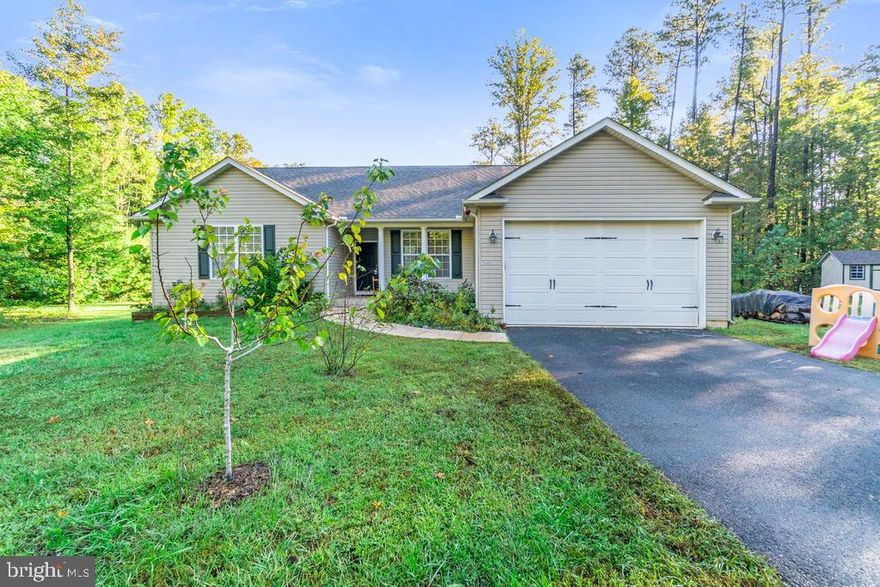 This well kept Ranch Style home is a  4 bedroom, 2 bathroom located in a cul-de-sac. The home is on 1 level and with a great floor plan. There are 3 bedrooms on one wing and the main bedroom is on the opposite wing creating a private space for the new owners of this home.  The home includes the conveyance of the chicken coop, utility shed, raised garden beds, patio, greenhouse, bar on deck, kids play set, dog/pet house and 50 gallon rain barrel.  There is an extra 1/2 acre compared to other lots in the community.  This property also includes fruit trees: apples, cherries, apricots, blackberries and mulberry.  Please call the agent to schedule a property tour.