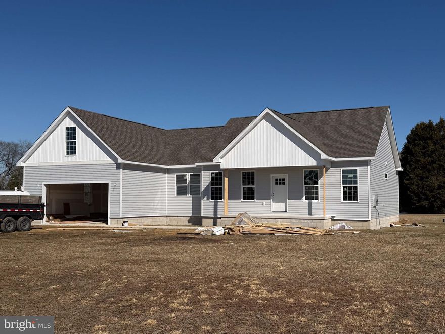 Discover modern living in this brand-new home currently under construction in the desirable Green Briar community. Step from the welcoming front porch into a bright, open-concept main level featuring a spacious family room, dining area, and a gourmet kitchen with a large central island and a walk-in pantry hidden by a stylish barn door. A six-foot sliding glass door opens to the backyard, filling the space with natural light.

This home offers a smart split-bedroom layout for privacy. The serene owner's suite includes a large walk-in closet and a private en-suite bathroom with a 5-foot shower. Two additional bedrooms and a full bath are located on the opposite side of the home, perfect for family, guests, or a home office.

A key feature is the massive, unfinished second floor, offering a blank canvas for a future game room, home theater, or any other space you can imagine. The home also includes a first-floor laundry room and an attached two-car garage.

Located just minutes from Seaford's shopping, dining, and the Nanticoke River, this home combines neighborhood charm with convenient access to amenities. Contact us today to learn more about this exceptional opportunity!

Please note: This home is currently under construction. The most recent photographs of the home were taken on February 13th, 2026. Estimated completion is to May 2026.