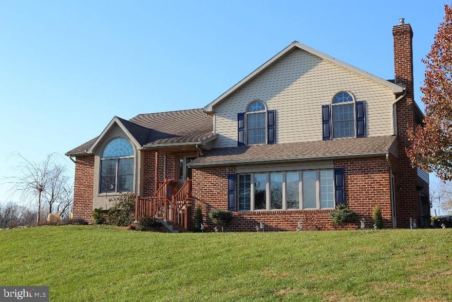 Kitchen and Master Bath have been beautifully upgraded. Kitchen quartz countertops, master bath custom tile shower and tile floor. New sunroom in 2012. New flooring, gas stove in family room, new kitchen high end stove, new SS double bowl deep sink, tile back splash. New porch awning. Reserved items: Chandelier in Dining Room and Ceiling Lamp in foyer.