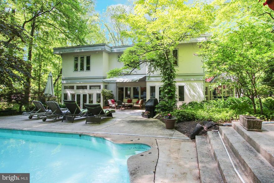 DO NOT CALL!!!Cool Contemporary 6BR 5.5 BA House w/ pool!  Windows everywhere! Hardwood Floors on 2 levels, Spacious BRs updated BAs. Eat in Gourmet kitchen w/ adjacent screened in porch. 2 BR on Main level. Upstairs Master & 2 additional BR plus office area, study and gym.  Lower Level w/ BR, FB Rec area, wet bar and lots of storage. Park like setting back yard w/ patio and pool. Whitman Schools!