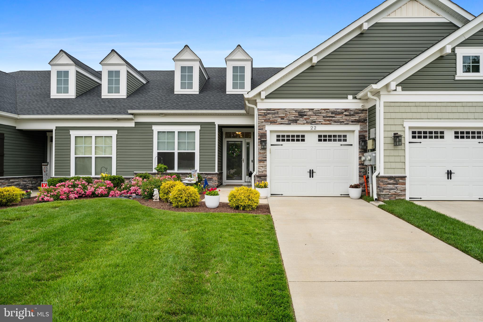 Welcome to low maintance living in style! Nestled in a vibrant and amenity-rich 55+ community, this beautifully maintained home is less than 5 years old with tons of great features and updates throughout! With stunning curb due to the lush sod lawn, landscaping, and stunning stone and vinyl exterior—this home makes a great first impression that only gets better inside! Step through the front door to 9' ceilings and luxury vinyl plank flooring that flows seamlessly throughout the main living areas. Head into the kitchen off the foyer, showcasing granite countertops, tile backsplash, an oversized island with built-in cabinetry, and abundant recessed lighting! The inviting family room boasts a custom mantel, electric fireplace, and built-in shelving. Sliding glass doors in the family room lead to your back patio—perfect for morning coffee or evening relaxation! The spacious primary bedroom includes a large walk-in closet and attached bathroom with a walk-in shower. A second bedroom with a ceiling fan and another full bathroom provides comfort and convenience for guests. This home also includes a full laundry room with direct access to the garage and a HVAC system just replaced in 2024! Enjoy community amenities including a pool, fitness center, clubhouse, walking trails, and more. Located just minutes from shopping, dining, medical facilities, and everyday conveniences, this home truly offers the best of active adult living. Don't miss this opportunity to embrace comfort, style, and a carefree lifestyle in this great 55+ community!