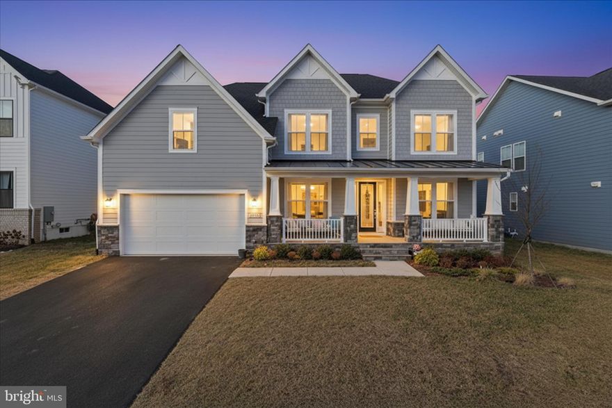 Welcome to Hartland, one of Northern Virginia’s most desirable communities. Located within Main Hartland, this sophisticated DRB Albemarle model, built in 2024, offers over $200,000 in upgrades and every available bump-out, blending modern farmhouse style with luxury, comfort, and elegance.
Situated on a premium east-facing quarter-acre lot, this meticulously landscaped home offers exceptional curb appeal and an inviting presence. Inside, you are greeted by a grand foyer, soaring ceilings, abundant natural light, and nearly 5,000 finished square feet across three beautifully finished levels. The home features 6 bedrooms, 5 bathrooms, and a front-load 2-car garage.
The main level showcases upgraded luxury wide-plank flooring, a spacious library, a separate dining room, and a rare main-level bedroom with a full bath, ideal for guests, in-laws, or multigenerational living. The gourmet kitchen is the heart of the home, featuring premium cabinetry, quartz countertops, floor-to-ceiling extended cabinetry, custom lighting, upgraded refrigerator and dishwasher, and professional-grade appliances. The kitchen flows seamlessly into a sun-filled dining area and an expansive family room with soaring 24-foot ceilings, oversized windows, and stunning architectural details.
Upstairs, you will find 4 spacious bedrooms, 3 full bathrooms, and a conveniently located laundry room. The luxurious primary suite features tray ceilings, dual walk-in closets, dual vanities, and a spa-like bath with a seamless glass two-head shower. The secondary bedrooms are generously sized and complemented by upgraded carpet and additional full baths.
The fully finished walkup basement is designed for both relaxation and entertaining, offering a large rec room, a fully functional kitchen, luxury wet bar, separate dry bar with seating, custom mood lighting, an additional bedroom with egress window, a stylish full bath, and a dedicated gym room. A private guest or au pair suite with walk-in closet and attached full bath adds even more flexibility. There is also an unfinished area for ample storage or future Media/Theatre room or any other purpose.
Step outside to enjoy the expansive backyard oasis, perfect for quiet evenings, summer gatherings, and entertaining under the stars. Additional upgrades include a sprinkler system, Tankless water heater, epoxy garage flooring, built-in storage racks, extra-long driveway, large water heater, furnace humidifier,whole-house water filtration system, finished garage, radon mitigation system, and premium structured wiring.
Ideally located just minutes from Old Farm Winery, the Hartland Club House, Hal and Berni Hanson Regional Park, top-rated Loudoun County schools, premier shopping and dining, and major commuter routes including Route 50, Loudoun County Parkway, Old Ox Road, the Dulles Greenway, and the Silver Line Metro, this exceptional home offers the perfect balance of privacy, luxury, and convenience.