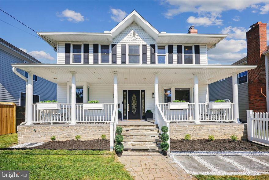 PRICE REDUCED.  Storybook transformation into a bright and open 6BR/5BA three-level colonial with old-fashioned front porch and off-street parking in Georgetown Village, only a block away from the elementary school. Following a 2022 expansion/renovation, the home nearly doubled in size, and its floor plan now boasts approximately 4,800 square feet of living area on three levels, including a new in-law/au pair suite on the lower level.    Fine craftsmanship, unique design, and quality materials define the showpiece home highlighted by an expansive open kitchen/dining/great room; hardwood flooring throughout the main and upper levels; renovated bathrooms with designer porcelain and ceramic tile; custom painting; upgraded lighting fixtures and recessed lighting; new LVP flooring in the lower level; Andersen windows, new roof and all-new siding. Peaceful outdoor space featuring professional landscape with manicured beds of designer shrubbery, a fenced-in yard with white vinyl picket in the front, and a private sunken patio with access to a storage room. Cobblestone paver walkway and flagstone steps to covered front porch with fieldstone water table, composite decking, beaded ceiling, vinyl railings, and recessed lighting; glass front door with side transoms open to foyer and living room/parlor with wood-burning fireplace and bay window; open concept chef’s kitchen with self-closing white shaker cabinetry with pull-out drawers, quartz countertops, tumbled tile backsplash, white porcelain farm sink with box window ledge, champagne bronze faucet and cabinet hardware, recessed lighting, upgraded appliances, commercial range hood, pantry cabinets and pantry closet; center island breakfast bar with pendant lighting and quartz waterfall countertops opens to informal dining area and great room with tons of windows and rear double French doors; great room with built-in linear electric fireplace, TV above, and a wall of built-in bookshelves; separate exterior side entrance into hallway with coat closet right outside of the main level bedroom/study; renovated main level full bath; solid oak staircase to upper-level hallway with designer chandelier, recessed lighting, and linen closet; glass French door into primary bedroom suite with recessed lighting, separate sitting area with built-in linear electric fireplace, double-door closet and walk-in closet with custom built-in shelving and drawers; primary bathroom renovation in 2025 features 24” x 48” porcelain flooring, double vanity with marble top, clawfoot soaking tub; walk-in shower with designer floor and porcelain tile surround, and separate water closet; three additional upper-level bedrooms with chandeliers and recessed lighting; remodeled hall bath with ceramic tile flooring and tub with porcelain tile wall surround connected to upper-level laundry room with full-size washer & dryer, utility sink, and cabinet storage; finished lower-level of original home with LVP flooring, recreation room and fitness room with full bath; step-down to newly finished in-law/au pair suite with private glass door side entrance; LVP flooring; second laundry hook up for stackable unit; bedroom with recessed lighting and walk-in closet; new porcelain tile full bath with zero-entry curbless walk-in shower; full daylight living room with recessed lighting, linear electric fireplace, full kitchen, and French doors to sunken concrete patio; storage room access from outside patio; three zones of heating and cooling (2018 and 2022), new roof, siding and gutters (2022).