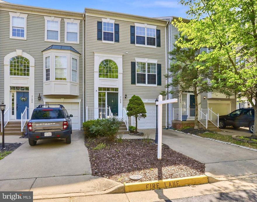 Welcome to this beautifully maintained townhome featuring a rare three-level bump-out in the highly sought-after Broadlands community. With over 2,600 square feet of thoughtfully designed living space, this home blends modern comfort with timeless appeal—truly move-in ready. The main level offers a bright and inviting layout with a spacious living room, a cozy family room with fireplace, and a well-appointed gourmet kitchen featuring oak cabinetry, a center island, granite countertops (2021), and stainless steel appliances including refrigerator, range, and dishwasher (2021). Just off the kitchen, enjoy a large private deck—ideal for entertaining or relaxing outdoors. Upstairs, the impressive primary suite showcases a vaulted ceiling, a spa-inspired bath (renovated 2021), and ample closet space. Two additional bedrooms and an updated full hall bath (2021) complete the upper level. The finished walkout lower level expands your living space with a versatile recreation room, fourth bedroom, full bath, and direct access to the fenced backyard and patio. Throughout the home, you’ll find thoughtful updates including hardwood flooring on the main and upper levels and stairs (2016), luxury vinyl plank flooring on the lower level (2023), updated sliding doors (2022), and an upgraded front door and frame (2016). The HVAC system was replaced in 2023, the washer in 2022, and the dryer in 2021. Additional highlights include a garage door (2016) with opener (2020), recessed lighting (2015), rustic metal stair railings (2015), updated exterior light post connection (2020), and new front exterior light fixtures (2025). Ideally located, this home provides access to Broadlands’ exceptional amenities—pools, trails, playgrounds, and sports courts—just minutes from the Ashburn Metro, Beaverdam Reservoir, shopping, dining, and scenic walking paths. A perfect blend of space, style, and convenience—ready to welcome you home.