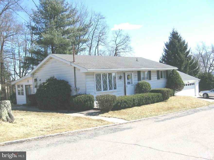 Corner property,Ranch style home with attached 2-car Garage/Driveway/Breezeway.Brand new Kitchen cabinetry with granite countertops,stone textured backsplash,stainless steel deep double sink & laminated flooring.Sliding glass door leading into your 3-season Sunroom.Freshly painted walls thru-out home along with new w/w carpeting.Central Air.1st floor full Bath,ceramic tile flr & new toilet.Bedrooms with sizeable closet space.Lower level,spacious finished family room,new w/w carpet & 1/2 Bath.Interior access to Breezeway & Garage.Side & backyard area.Oil heat. Attic /access panel with full storage above.Immaculate condition home/Move-in Ready!!
