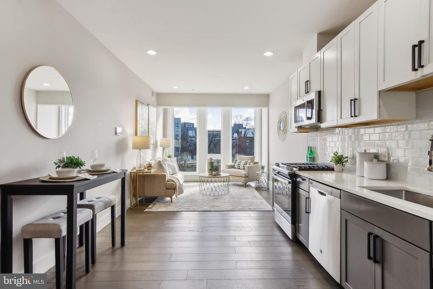 $25,000 PRICE IMPROVEMENT!
An extraordinary opportunity just became even more irresistible. This stunning condo is now priced significantly below market value, offering an unmatched opportunity in today's competitive market. Position yourself to gain INSTANT EQUITY the moment you close. Opportunities like this don't come often. This is your chance to secure an incredible home at a remarkable price.
This beautiful 3-bedroom, 2-bathroom condo is just a few blocks from H Street, Eastern Market, and the U.S. Capitol. The bright and spacious unit boasts sleek, contemporary finishes, stainless steel appliances, modern bathrooms, and a convenient front-loading washer and dryer, making it a wonderful place to call home. The building offers a range of excellent amenities, including both indoor and outdoor parking, a fitness center, elevator, bike rack, dog washing station, and a green roof.

In addition, the condo comes with exclusive access to a private rooftop spot, ideal for watching the 4th of July fireworks, enjoying a morning coffee, or relaxing with friends in the evening. Don’t miss your chance to own this stunning condo in the heart of Washington, DC—this exceptional opportunity won’t last long!
