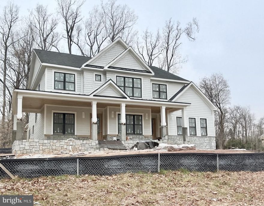 Welcome to this exquisite, brand-new home built by esteemed builder, ERB Properties. This home offers an outstanding open floor plan with 3 finished levels, 7 bedrooms, 6.5 bathrooms and over 6,500 square feet of living space! Featuring upscale craftsmanship and finishes, abundant recessed lighting, wide plank hardwood floors, custom moldings and plenty of windows to let in the sunshine, it is ready for you to move right in! On the main level you will find an inviting living room, a formal dining room, a gourmet chef’s kitchen with high-end appliances, soft close cabinets & drawers, quartz countertops, a center island, a walk-in pantry a breakfast area and a light and bright gorgeous family room with a gas fireplace leading out to a covered porch. The main level also features a guest bedroom with a full bathroom, a mudroom with cubbies and a bench off of the three-car garage and a powder room. The spectacular upper level includes a relaxing primary suite with two custom walk-in closets, a luxurious spa bath with a separate frameless glass enclosed shower, soaking tub and two sinks. Also on the upper level are 3 additional bedrooms, each with their own private full bathroom, a family/homework-study area and a laundry room with a sink, cabinets, washer and dryer. On the fabulous walk-up lower level you will find a delightful recreation room with a wet bar and beverage refrigerator, two bedrooms, a full bathroom, an exercise room with a mirror and rubber floor, extra storage areas and a separate side entrance. This home is part of the Walt Whitman High School cluster.