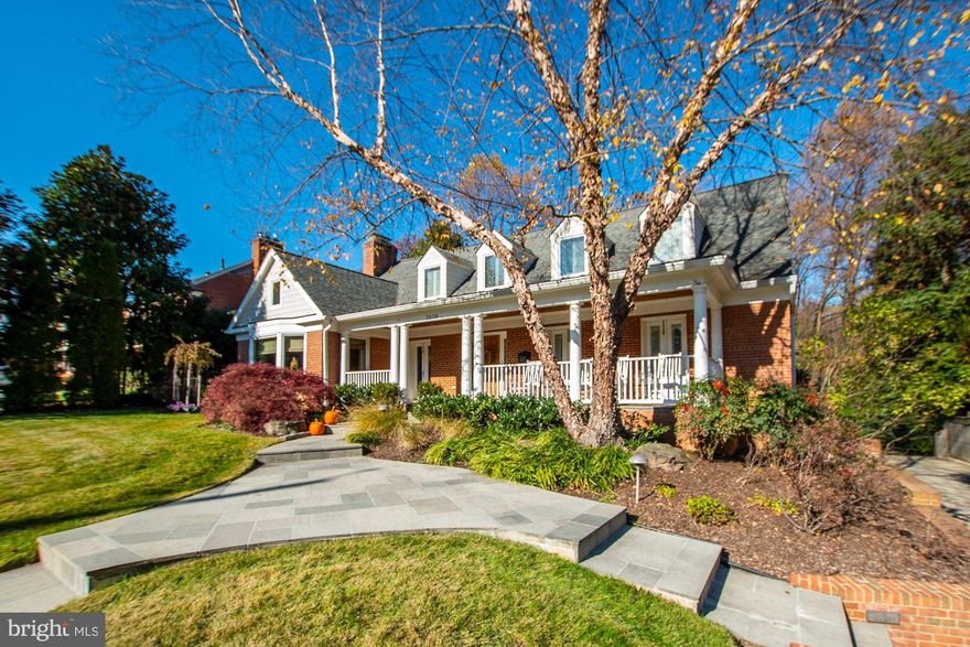 Stunning Williamsburg Colonial beautifully expanded and renovated - a must see!  Stunning kitchen renovation boasting top-of-the-line cabinetry, wall ovens, beverage fridge, stainless steel appliances, breakfast bar, prep sink with glass front cabinets, counter-depth sub-zero refrigerator and sun-filled breakfast room with fantastic views of the private backyard.  Wonderful family room with wood burning fireplace and French doors to patio with fireplace.  The main level also features a main level bedroom (could be owner's suite or guest room) with en suite bath, a large dining room with fireplace, living room, office with fireplace and half bath.  The upper-level gorgeous Owner's Suite with tray ceilings, gas fireplace, large walk-in closet and large en suite bath with soaking tub and oversized corner shower. Three additional bedrooms with walk-in closets and a hall bath complete the upper level. The lower level has a family room with built-in shelving and a wood burning fireplace, laundry room, utility room, sitting area and a bedroom  suite with full bath with lots of storage and walk-out to driveway.  The huge backyard flagstone patio is a perfect place for entertaining and the surrounding tree line provides privacy and serene views. A truly lovely home in the sought-after Hamlet neighborhood of Chevy Chase, close to upscale shopping, dining, parks, the Bethesda Metro and the future Purple Line!