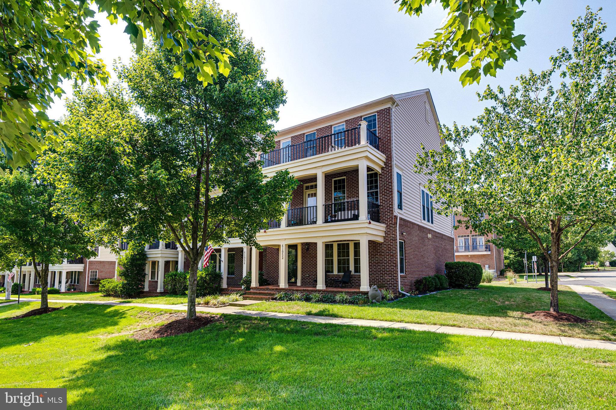End-unit townhome in the highly sought-after Greene Mill Preserve, exuding Southern charm with its multiple porches and abundant natural light from additional windows. Open concept layout featuring formal living and dining room with hardwood floors. kitchen island, fireplace, stainless steel appliances. Primary suite with two walk-in closets, double sinks in the bathroom, a soaking tub, and a separate shower. Two more spacious bedrooms, a full bathroom, and a laundry room complete the upper level.