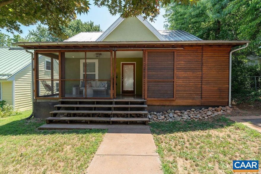 Nestled just a quick walk from downtown Belmont, this lovingly renovated home offers cottage living at its finest. Just past the tree lined sidewalk and off street parking, a screened-in porch with sliding walls provides the perfect perch for starting and ending the day. Once inside, you?re greeted by a spacious great room with open kitchen, beautiful hardwood floors, and a soaring ceiling. Wide kitchen island of Cambia Ash allows for a relaxed dining and entertaining experience. German Greenstone countertops flank the gas range. Dining room features a bank of floor-to-ceiling windows overlooking the nearly level yard. Primary suite includes a private bathroom. Additional full bathroom off the dining area. Second bedroom could serve as the perfect guest spot or ideal office/den. Backyard has a patio and the size provides great potential for gardening, pets, and play for the next owner. Many recent updates. Abundant light throughout. Previously featured in Cottage Living. 1/2 mi. to excellent dining in Belmont, just a few minutes to the Downtown Mall, UVA, and all things Charlottesville.