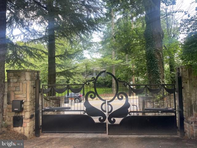 WALK TO DOWNTOWN BETHESDA, DOUBLE GATED W/WALLS, SWIMMING POOL W/ WATERFALLS, BASKETBALL, 5BR, 4.5FB, 2 CAR GARAGE, FULL FINISHED BASEMENT WITH BAR, WATER POND IN FRONT YARD, PROFESSIONALLY AND GORGEOUS LANDSCAPED YARD WITH PLENTY OF PARKING SPACES, FLAG STONED BACK YD W/BUILT IN BBQ, GREAT RM, OVER SIZED LR, AND MUCH MORE, TENANT HAS OPTION TO RENT FURNISHED (PRICE TO BE DISCUSSED)