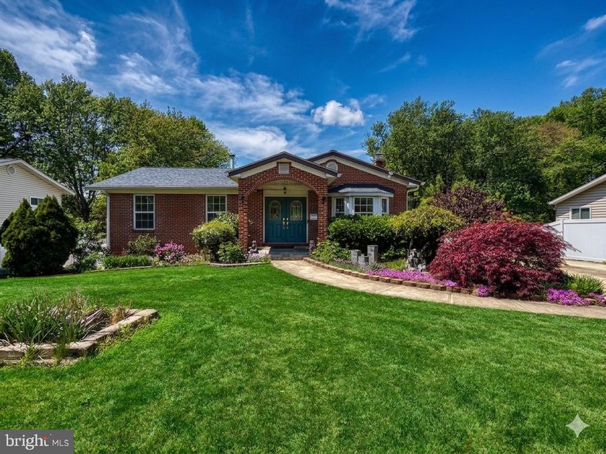 ***MAJOR $52K PRICE IMPROVEMENT! *** Discover unparalleled scale and quality in this stunning, turnkey Ravensworth Grove residence, boasting approximately 4,438 square feet of sun-drenched living space on a nearly half-acre lot (2 parcels). Perfectly designed for multi-generational living, this six-bedroom, six-bathroom home features three en-suite bedrooms—with options on both levels—and a premium two-story extension (completed 2002) characterized by rich millwork and three massive Palladian windows (replaced in 2024) w/ custom remote controlled solar blinds (2024). This meticulously maintained property offers long-term peace of mind with newer siding and gutters (2020), newer roof (2024), a reliable HVAC system (lower level system & 2 exterior compressors 2015; upper level system 2019), and a fully enclosed backyard featuring new vinyl privacy fencing (2024). The grand main level features elegant hardwoods and a gourmet kitchen that flows into a unique enclosed cooking balcony with a dedicated exhaust fan, while the bright, walk-out lower level serves as a secondary retreat with luxury vinyl floors and a massive recreation room with a wood-burning fireplace. Your private outdoor oasis is anchored by a custom concrete patio (2019) and a tranquil koi pond with waterfalls (2021), surrounded by mature fruit trees, a vegetable garden, and a tool shed. Modern amenities abound, including a large concrete driveway with an EV charger, all situated just minutes from Mosaic District, NVCC, George Mason University, Tysons Corner, and Washington D.C.   Short walk to neighborhood grocery store, restaurants, boba tea shop, medical offices.  ****Please note: Some photos in this listing have been virtually renovated using AI to illustrate the property’s potential. These images are for conceptual purposes only and do not represent the current state of the home.  ***Check out this walkthrough video of the property: https://youtu.be/suPEPTnOdBQ