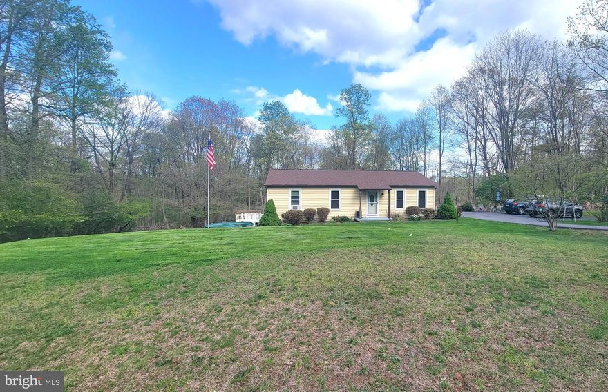 This well maintained rancher is on 1.9 acres of land. There are three bedrooms and 1.5 baths.  The main bedroom has it's own half bath.  First floor laundry was added to bedroom 3 (original hookups remain basement).  Spacious living room and family room in the lower level.    Owner did many improvements during ownership: new windows and doors, roof replaced,  driveway repaved, new hot water heater,  2 mini splits added (main BR and living room), new vanities in bathrooms, professionally built family room with Owens Corning finishing system. The lot is 1.9 Acres.  The back half is wooded.  You could heat the home with wood if you desired.  Home was built with drainage system on both sides of the foundation.  The basement has always been bone dry.  The setting is beautiful with the home set far back from the road.   Seller must find suitable housing.  He already has a home picked out.  Come see this home and let your journey begin here:)