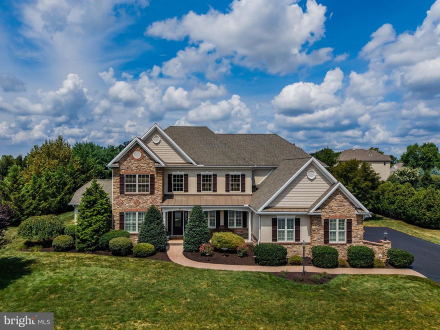 Welcome to 507 Jonagold Circle in Mechanicsburg, located in the highly desired Mechanicsburg Area School District. This beautiful 4-bedroom, 4.5-bath home offers hardwood flooring, soaring ceilings, and a newly remodeled kitchen that flows into a light-filled four-seasons sunroom. Upstairs features a convenient second-floor laundry alongside the bedrooms, while the fully finished basement includes a room designed for a cinema/theater. The three-car garage comes complete with a built-in dog wash, and the backyard is made for entertaining with a covered patio, two-sided fireplace, and a large flat yard perfect for a pool or play. Thoughtfully designed with both elegance and functionality, this home is move-in ready and waiting for its next owners.