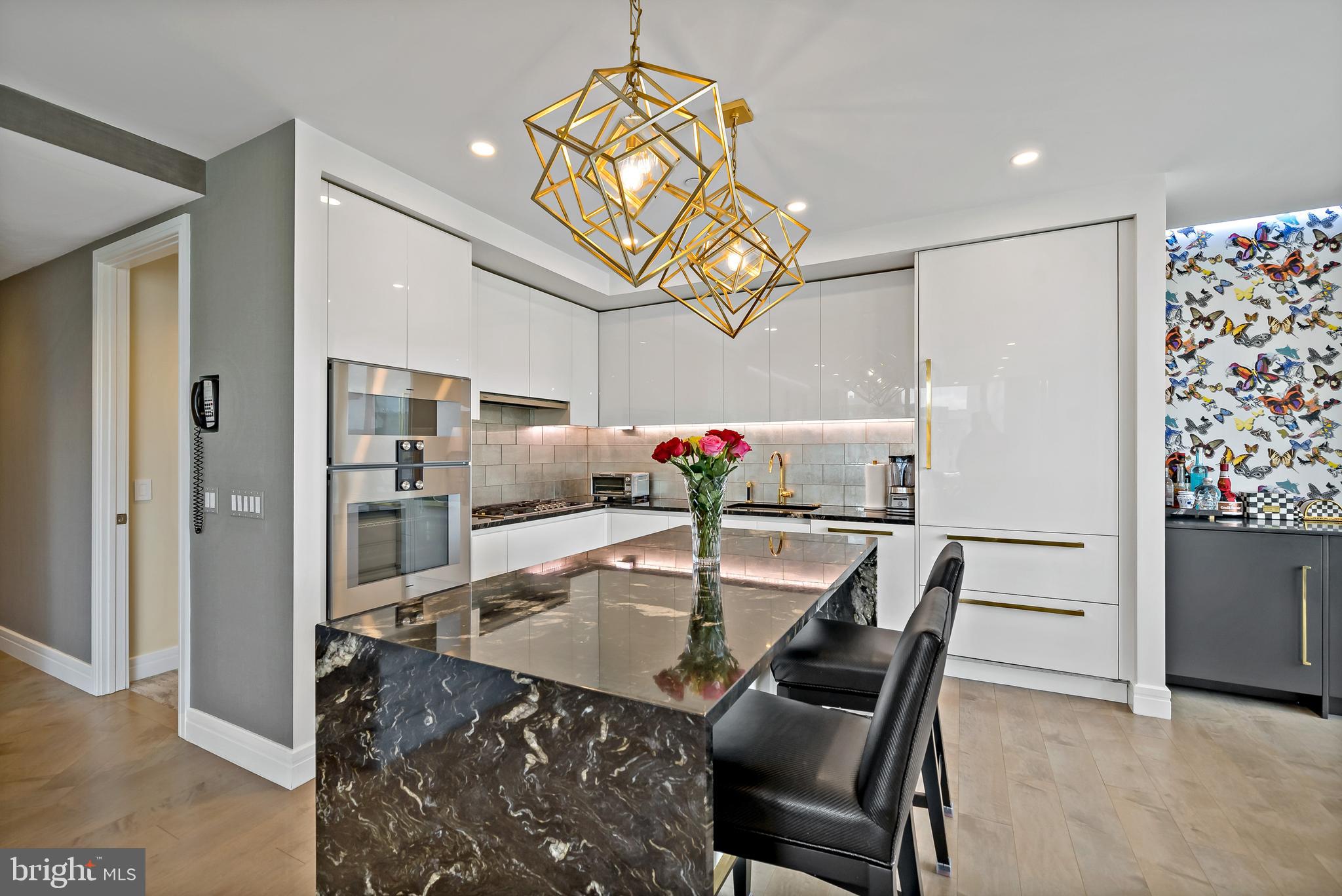 FULLY RENOVATED – Luxury Condo 3BR, 3.5 Bath, Balcony at The Ritz Carlton
Residences This unit was gutted & fully renovated including Joanne Hudson kitchen,
Ann Saks bathrooms, Mirage and Stark flooring – soup to nuts renovation! The unit
features many high end design features and state of the art technology that include:
Kitchen: Gaggenau Convection Oven, Gaggenau Oven/Microwave Combo, Gaggenau
Five-Burner Brass Gas Cooktop with Wok burner, Fully Vented Hidden Gaggenau
Range Hood, Kallista Faucets, Ann Sacks Marble Tile Glass Backsplash, Joanne
Hudson Kitchen with Downsview white lacquer millwork and granite waterfall island and
Kelly Wearstler Visual Comfort Lighting Fixtures Bathrooms and Powered Room:
Kallista Faucets and Sinks, Ann Sacks Marble Tile, Kelly Wearstler Marble Mosaic Tile
Flooring: Mirage Wood Floors Through Foyer, Kitchen, Living, Dining and 2nd/3rd
Bedrooms and custom Herringbone Wood Through Foyer and Stark Carpeting in Master
Bedroom Lighting: Recessed LED lighting throughout household and LED acccent
lighting with RGB color options in kitchen, living, dining, and all bedrooms plus Kelly
Wearstler Visual Comfort Lighting Fixtures in Kitchen, Bathrooms, and Primary Bedroom
Closets and Storage: California Closets throughout all closets, California Closets built-in
millwork in all bedrooms with granite tops in 2nd/3rd bedrooms Design: Kelly Wearstler
and Christian Lacroix Wallpaper Throughout & Nero Marquina Marble mantle with
European Home Gas Fireplace Technology: Complete Smart Home with Controllable
Lutron Lighting, Audio/Video Systems, Fireplace, & HVAC Invisible Speaker Surround
Sound System - Inside walls and ceiling ElectroLux Extra Large Washer & Dryer Fully
concealed sprinkler system Fiber Optic Internet
The Ritz-Carlton Residences with distinctive attention to details and design. This 3
Bedrooms, 3 1/2 Baths unit features a balcony with views of Dilworth Park and City Hall
Clock Tower. The Ritz offers some of the best amenities in the city, such as:
Chauffeur-driven town car, State of the Art Fitness Center with 54 ft. Lap Pool and Yoga
Room, Gated Landscaped Garden with 12ft. Water Wall, 24 hr. Concierge and Front
Doorman, newly renovated Residents Lounge & Media Room and dog run. 1 parking
spot included in listing **2nd car parking spot available for additional fee**