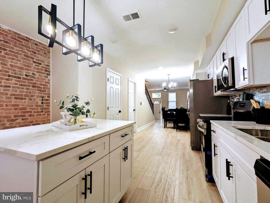Welcome to this fully renovated rowhome in the esteemed Pigtown. Offering exceptional convenience, situated near prominent attractions such as the downtown Inner Harbor, Ravens and Orioles Stadium, and Lexington Market, among others. Its proximity to I-95 provides seamless access to New York, D.C., and BWI Airport. Positioned on a promising street undergoing extensive renovations, this is a prime investment opportunity to watch your equity grow with each nearby vacant being renovated.  With this property being renovated from top to bottom, and all major components being brand new, it provides peace of mind and allowing you to focus on enjoying life. The fenced patio area in the rear can easily be converted into a parking pad, (seller will consider converting) offering two additional parking spaces. The property boasts three full bathrooms and a half bath on the main level.  A spacious rec room in the lower level adds additional living space, separate laundry area featuring new front-loading washer and dryer just adds to the charm of this property!   Get Ready, to tour your new home.