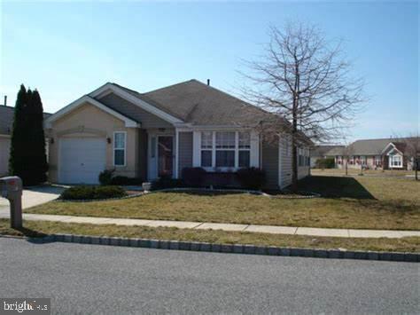 Welcome to this rancher located in a desirable 55+ community in Washington Township! This inviting home offers two spacious bedrooms and two bathrooms, perfect for comfortable living. The living room and dining room boast newer LVP flooring, providing a sleek, modern look, while recessed lighting adds warmth and ambiance. A versatile bonus room off the dining area offers the ideal space for an office, den, or additional living area. The primary bedroom is a peaceful retreat, featuring a walk-in closet and a full private bath for added convenience. Don’t miss the opportunity to make this lovely home yours!