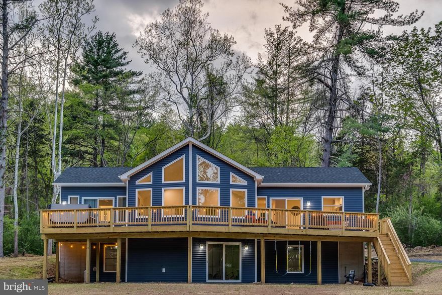 Captivating mountain getaway situated in one of Virginia's most charming rural areas. Stepping inside truly feels like entering a magazine, as no detail has been spared in this remarkable property. Known as "Whispering Pines Chalet," this successful short-term rental consistently ranks among the top vacation spots in the region. Located just over an hour and a half from Washington D.C. and merely a stone's throw from Shenandoah National Park, the Shenandoah River, Skyline Drive, and the George Washington Forest, the location couldn’t be better. Whether you're seeking a profitable side venture or a full-time residence, this stunning home is a fantastic choice. It features a state-of-the-art, 7 person Viking Regal, hot tub just outside the exquisite primary suite, which is a favorite among guests. Another popular attraction is the fire pit, along with swings and hammocks! If the weather isn’t cooperating, the lower level offers entertainment with a billiard table, dart board, and an indoor-outdoor corn hole set. There’s also a gaming table, PlayStation, and high-speed internet available. The expansive deck at the front of the house, with breathtaking mountain views, is perfect for summer barbecues. As the night falls, gather around the fire pit for stories and S'mores on the Adirondack chairs beneath the starry sky and twinkling string lights. This turnkey property highlights meticulous attention to detail. For those needing extra space, the full unfinished basement offers approximately 1300 additional square feet filled with natural light and accessible through double doors. It’s rare to find a business that is entirely set up for immediate returns. The seller will include all furnishings, as well as fully transferable short-term rental documentation, an upcoming reservation list, and connections to the exceptional service providers who have supported the operation. Showings are by appointment only.