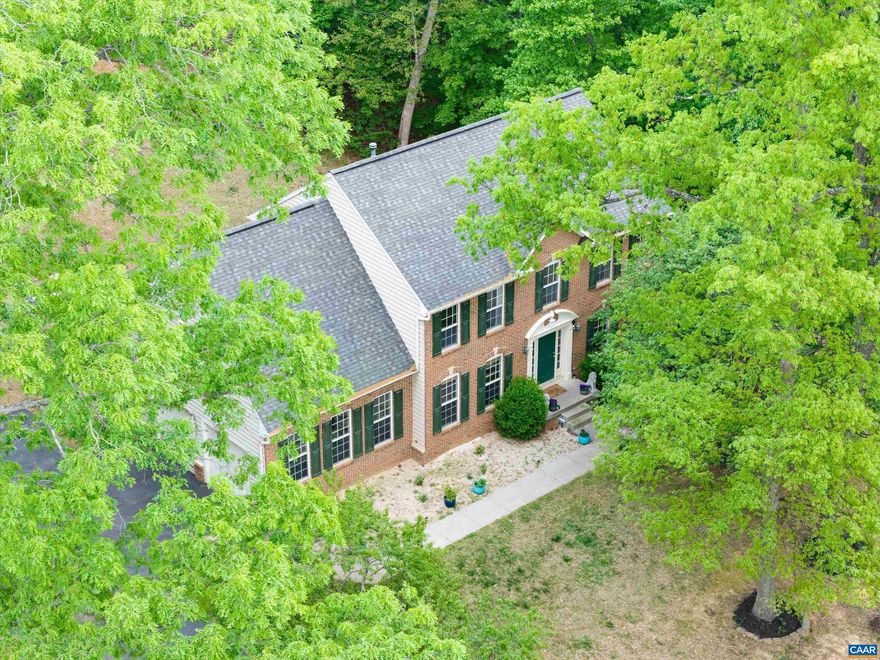 Imagine stepping out your back door Saturday morning.. birds singing, a peach tree dropping fruit into the grass, berry bushes ready to gather. Set on 1.71 private acres in sought after Reedy Creek, this 5 bedroom, 4 bath brick Colonial offers over 4,100 sq ft designed for both everyday living and entertaining. A dramatic two story foyer, soaring ceilings and updated marble flooring create an impressive first impression. Oversized windows flood the gourmet kitchen and breakfast room with natural light, while the open layout flows seamlessly into the living room with a cozy gas fireplace. Upstairs, the primary suite feels like a true retreat with a spa-like bath featuring a soaking tub, separate shower, dual vanities, and walk-in closet. Hardwood floors run throughout the entire second level. Four additional bedrooms, including an oversized guest suite, complete the floor. The finished walkout basement offers a full bath, flex room, and expansive living area perfect for entertaining, guests, or multigenerational living. Outside, enjoy three separate entertaining spaces including a brand new deck, mature fruit trees, and peaceful privacy. Fresh paint, updated fixtures, Firefly fiber, easy access to I-64.,Granite Counter,Wood Cabinets,Fireplace in Living Room