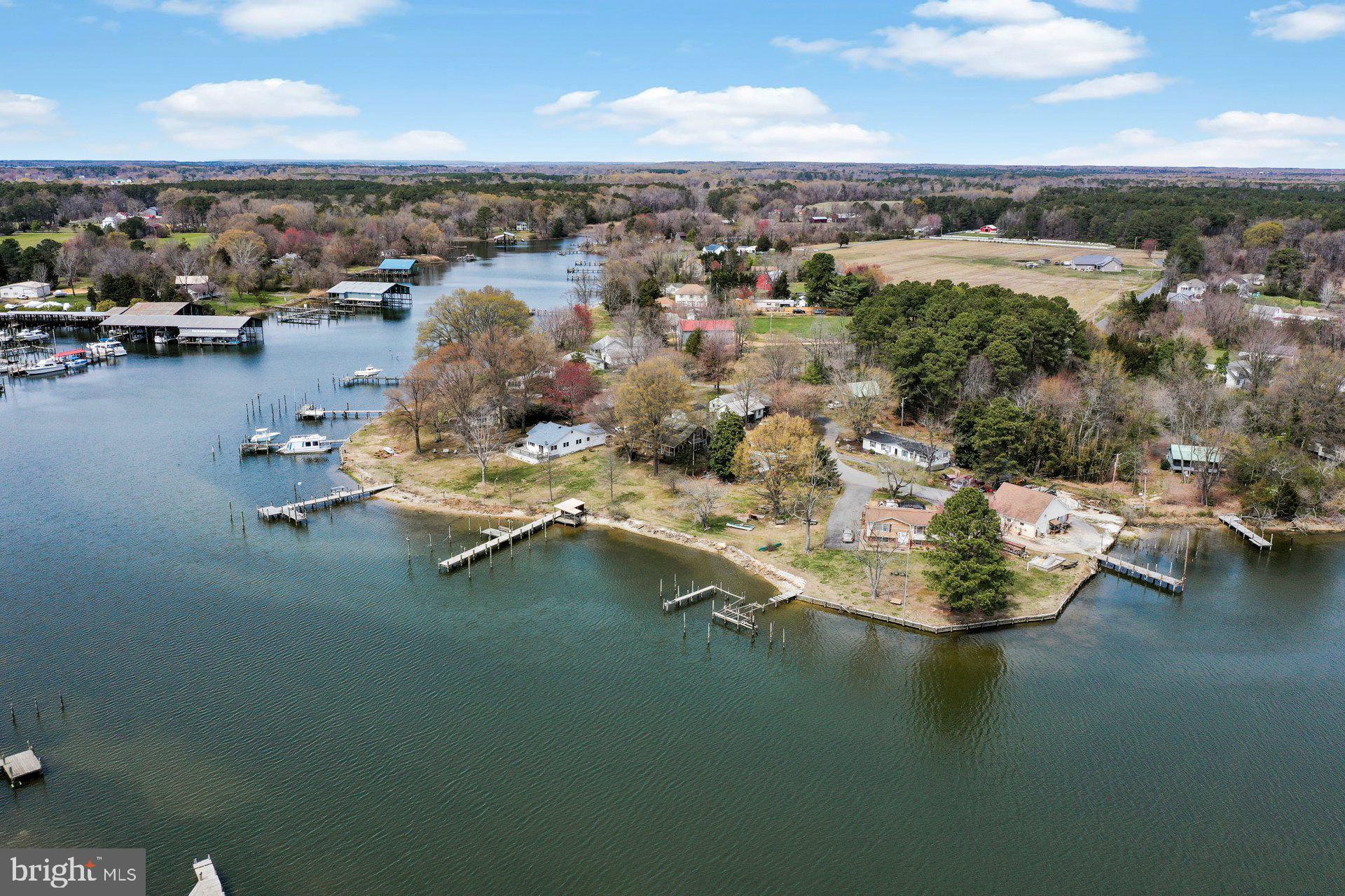 Available to move in! Waterfront property you can make yours. Do not miss out on this home in a quiet neighborhood. Fish and crab from your own dock at this amazing waterfront home with beautiful views on protected St. Patrick’s Creek, with 120’ of bulkhead shoreline, pier, 8000 pound electric boat lift, and deep water access just minutes out the channel to the Potomac River. Marina, fuel and boat ramp directly across the Creek. Foundations for davits for jetski and boats. Bungalow house with 4 bedrooms, 2 bath, great room with fireplace and two bay windows, porch and patio that looks across the lawn, with shade and flowering trees, to the water just 100’ away. Recently renovated kitchen with new cabinets, countertops, frig and electric range. New laminate plank floors throughout. Sits on .56 acres near the end of Olen Mattingly Road in a small quiet neighborhood for privacy and minimal traffic. Detached garage with separate electric meter and plenty of yard space for storage, sheds and parking. Feel secluded on this point of land, but also be close to a local market and gas 2 miles away. Convenient to the restaurants, stores and shops of Leonardtown and nearby coves, by car or by boat! Plenty of State park shoreline and beaches, including historic St. Clement’s Island, just at the end of the Creek! Make this your waterfront getaway less than an hour from DC!