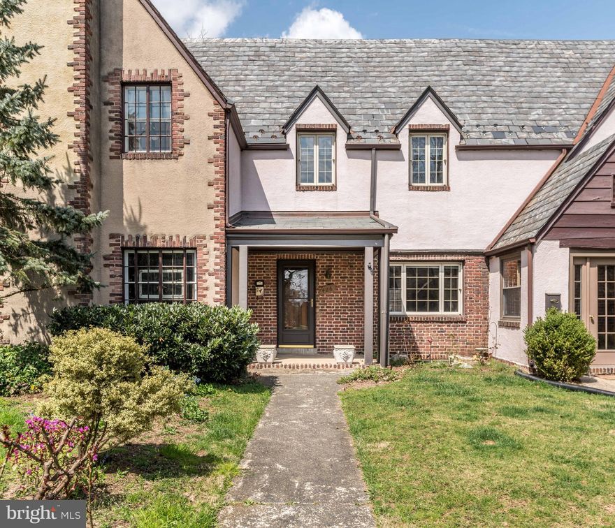 CLASSIC TUDOR STYLE ATTACHED ROW HOME IN OLD HOMELAND BOASTS BEAUTIFUL IN-LAY HARDWOOD FLOORS AND CONVENIENT REAR PARKING AND GARAGE! SPACIOUS LIVING ROOM WITH BOOKCASES, SEPARATE FORMAL DINING ROOM, BONUS ROOM/BREAKFAST ROOM & FRESHLY PAINTED KITCHEN THAT LEADS TO REAR DECK. UPPER LEVEL -3 BEDROOMS AND UPDATED FULL BATHROOM. LOWER LEVEL- PARTIALLY FINISHED BASEMENT WITH PLENTY OF STORAGE AND ENCLOSED FLUSH. HIGH EFFICIENCY MITSUBISHI AC WALL UNITS. LOCATED ON A BEAUTIFUL TREE-LINED STREET WITHIN WALKING DISTANCE TO SHOPPING AND DINING!