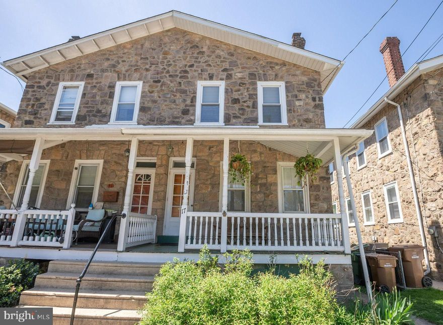 This solid stone twin home blends timeless charm with thoughtful updates, offering a truly special living experience in the heart of Ambler. A classic covered front porch welcomes you with a perfect spot to sip morning coffee or relax after a long day. Inside, the inviting living room flows into a formal dining area, both highlighted by rich hardwood floors that enhance the home's character. The kitchen features a crisp black-and-white tile floor, plenty of cabinetry, and generous counter space that makes meal prep and entertaining both practical and enjoyable. Just off the kitchen, a laundry and mudroom adds convenience and function, providing a smart solution for coats, shoes, backpacks, and everyday essentials. Upstairs, the second floor offers three bright bedrooms with beautiful hardwood flooring and plenty of natural light. The full hall bath has been completely renovated with great care and craftsmanship. Taken down to the studs, it now features tasteful tile flooring, a fully tiled tub and shower area, and a clean, modern design. The full basement offers excellent potential with its open layout and outside access. Whether you envision a home office, playroom, or workout area, there’s room to grow and customize. Out back, the nearly fully fenced yard provides a quiet and private setting. Mature plantings and thoughtful landscaping make it a peaceful retreat for relaxing, gardening, or outdoor dining. Located within the highly rated Upper Dublin School District, this home is just a short walk to downtown Ambler’s vibrant offerings including restaurants, shops, a movie theater, parks, and the train station. Commuters will appreciate easy access to Route 309 and the PA Turnpike. This well-maintained home is full of charm, quality, and comfort—all in a location that can’t be beat. HURRY!