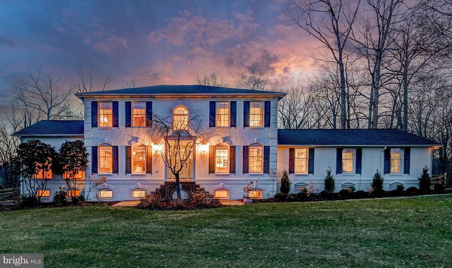 Live authentically. Nestled on a sprawling 10-acre glorious piece of land with panoramic vistas… this remarkable property exudes tranquility, offering the ultimate blend of country living with an abode that works seamlessly to support  your modern lifestyle… with exuberance! Surrounded by three holes of the Piney Branch Golf Course, the sense of arrival is as exquisite as the setting itself—winding gracefully through lush fairways before reaching this secluded sanctuary. This enduring classic white brick home, is infused with a stylish modern farmhouse aesthetic perched just so… to capture sweeping views of its serene surroundings. Light abounds. Be inspired in the cooking space… with proximate bar to craft, imbibe, and savor while creating culinary deliciousness…  Open concept gathering spaces anchored by a crackling fireplace in the center of it all. The primary suite is a haven of rest, offering the perfect environment for peaceful slumber, while the bath pampers with spa energy, radiant heated floors and a Toto toilet with bidet. Garden and grow heirloom tomato’s with out a worry…enjoy an expansive deer-proof garden brimming with nature’s bounty—mature peach, cherry, pear, apple, and nectarine trees, along with a rich collection of raspberry bushes, strawberries, asparagus, and flourishing beehives. The garden, supported by an irrigation system, thrives in harmony with its natural surroundings. A large Amish-built chicken coop with a sturdy metal roof and spacious enclosed run, complete with a pergola, offers luxury shelter  to your feathered inhabitants. Outdoor living is highlighted by a heated saltwater pool, which is complemented by a serene waterfall feature. The addition of a sublime, newly built screened-in porch provides the perfect space to relax and soak in the vistas and birdsong. The expansive outdoor living area features a full bar, built-in pizza oven, and a grill/smoker—ideal for entertaining or simply savoring the day’s bounty in an idyllic, sun-soaked setting. With a Kohler generator ensuring peace of mind, two sheds for additional storage, and a double-walled greenhouse that extends the growing season, every detail has been thoughtfully considered. The finished lower level offers endless possibilities for recreation, work, or pleasure. Rich in wildlife and natural beauty, this extraordinary estate is the ultimate place to sip, savor, and splash... create your next life chapter here…Xfinity Internet. Cultivate your existence. The art of uniting human and home.