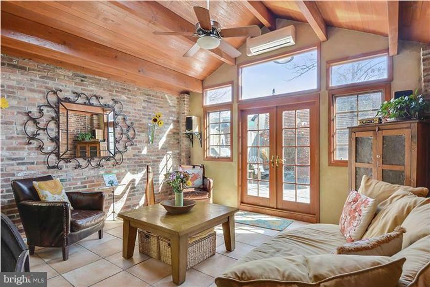 This artfully renovated, spacious townhome features a dramatic gourmet kitchen/family room addition with 2-sided fireplace, heated floors and remarkable flow to fabulous outside space. Large second floor den, master bedroom/bath, additional full BA and laundry. Two additional private bedrooms on 3rd floor.  Leased attached garage parking available. POOL BOND INCLUDED.