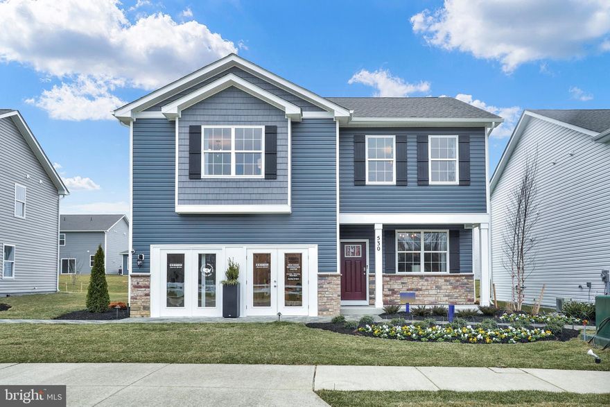 Former model home now available in the highly sought-after Pinegrove community! Introducing the Penwell floor plan, offering 4 spacious bedrooms, 2.5 luxurious bathrooms, a versatile flexible room, and a roomy two-car garage. Enter through the grand foyer into an open living space that seamlessly connects to an inviting eat-in kitchen. This culinary haven features elegant dark cabinetry, a granite island with seating, a spacious corner pantry, and high-end stainless-steel appliances, all enhanced by abundant natural light. The dining area provides a scenic view of the backyard and easy access through a sliding glass door for perfect indoor-outdoor living.

Upstairs, the tranquil owner's suite is a private retreat with a vast bedroom, generous walk-in closet, and an expansive owner's bath equipped with an oversized shower. Three additional bedrooms and a flexible space offer ample living area for the entire family. A conveniently located laundry room on this level makes chores a breeze.

The home is fitted with cutting-edge smart technology, including keyless entry, a video doorbell, and a programmable thermostat for seamless remote control. Enjoy speedy access to Routes 301 and 6 for effortless commuting. Shopping and dining at the St. Charles Towne Center are just minutes away. Experience unparalleled comfort and modern convenience in Pinegrove!