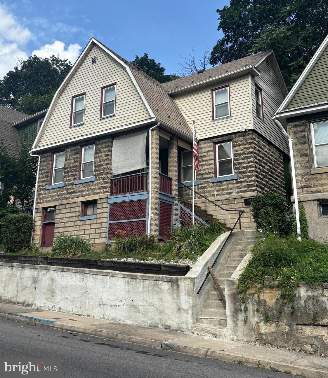 This 3-bedroom, 1-bath home features a traditional layout with two main-level living areas, a full bath, and spacious kitchen, with all bedrooms located upstairs. A covered front porch offers a nice spot to relax and enjoy the surrounding mountain views. Whether you're a first-time homebuyer or exploring rental potential, this property offers value, at an accessible price point. Some cosmetic updates and general repairs may be needed.