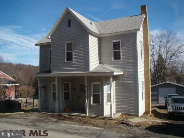 Very nice 2 story home with oak kitchen cabinets large yard and newer detached garage with covered patio.