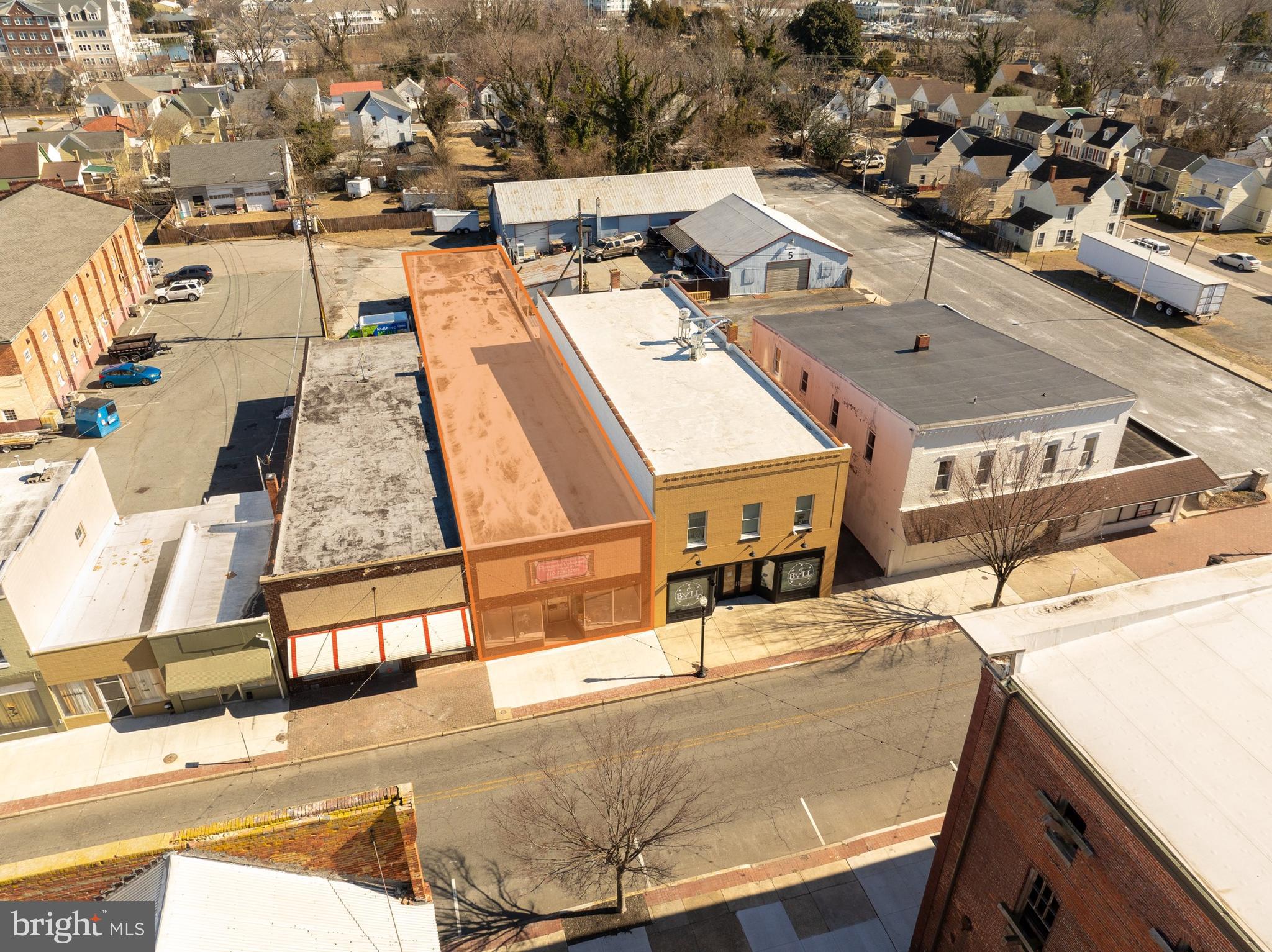 Introducing an opportunity at 518 Race St in Cambridge, MD. This 4,630 SF building, built in 1925, offers exceptional potential for retail and street retail users. Zoned Downtown/Waterfront Development District, it allows for a versatile amount of uses for commercial ventures. With a strategic location in the heart of Cambridge, this property provides large amounts of traffic with great visibility. 5+/- Parking spots are available for customer use, along with street parking. Central A/C & lighting were replaced in 2018, the roof was recoated with silicone in 2021, a window unit helps provide A/C to the warehouse portion of the building, which also contains an 8 ft roll up door, a 48" X 96" rear commercial entrance door, 12' ceilings throughout, along with one restroom. The property features an open layout, with two large showcase windows for advertisement. This property can also be purchased together with 522 Race St #Rear. Deeded right a way to Muir Main. Front Room 96x25, Rear Storage 30x25, 1/2 bath 6x4, Way Back Storage 35x27. Overall Length 158x27+/-. All offers are encouraged!
