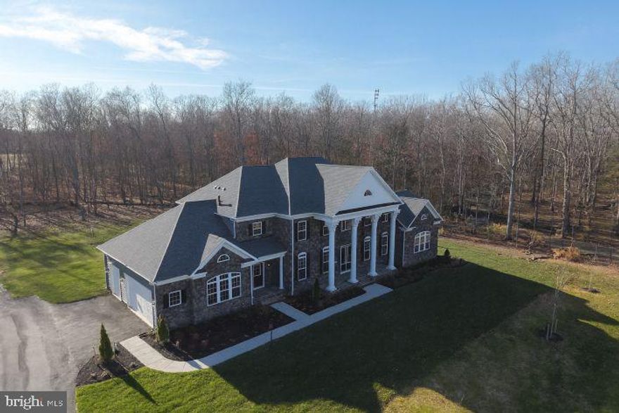 Welcome to this extraordinary Augustine Homes Stratford III model—an expansive luxury estate offering exceptional space, flexibility, and privacy across 10 beautiful acres in Nokesville. With over 8,400 total finished sq. ft. of living space (5,500+ sq. ft. above grade and an additional 2,900 sq. ft. finished in the walkout basement), this home is perfectly designed for multigenerational living, large households, or those needing extensive, customizable space.

The main level features a main level bedroom and ensuite full bathroom, gleaming wood floors, formal living and dining rooms, a private den/home office, and a spacious family room filled with natural light. The gourmet kitchen offers upgraded cabinetry, premium appliances, a center island, and abundant room for gathering and entertaining.  

Upstairs, you'll find five generously sized bedrooms, each with its own walk-in closet and private ensuite full bathroom—a rare and highly desirable feature that provides exceptional comfort and convenience for every member of the household. The luxurious primary suite includes a spa-inspired bathroom and expansive custom closet space.

The fully finished lower level is one of this home’s standout features, offering two separate apartment-style suites, each with private living quarters, full kitchens, bedrooms, and full bathrooms—ideal for extended family, multigenerational living, an au pair, or private guest accommodations.
• Apartment 1: 2 bedrooms, 1 full bath, full kitchen
• Apartment 2: 3 bedrooms, 1 full bath, full kitchen

Enjoy a three-car garage, long private driveway, and rolling acreage that provides peace, quiet, and space rarely available in Northern Virginia. Despite its privacy, the property remains close to commuter routes, shopping, dining, and highly regarded schools.

This exceptional estate is available for sale and rent at $9000 per month—a rare opportunity to enjoy luxury living on a private 10-acre property with room for everyone.

Schedule your private tour today—this one-of-a-kind opportunity won’t last.