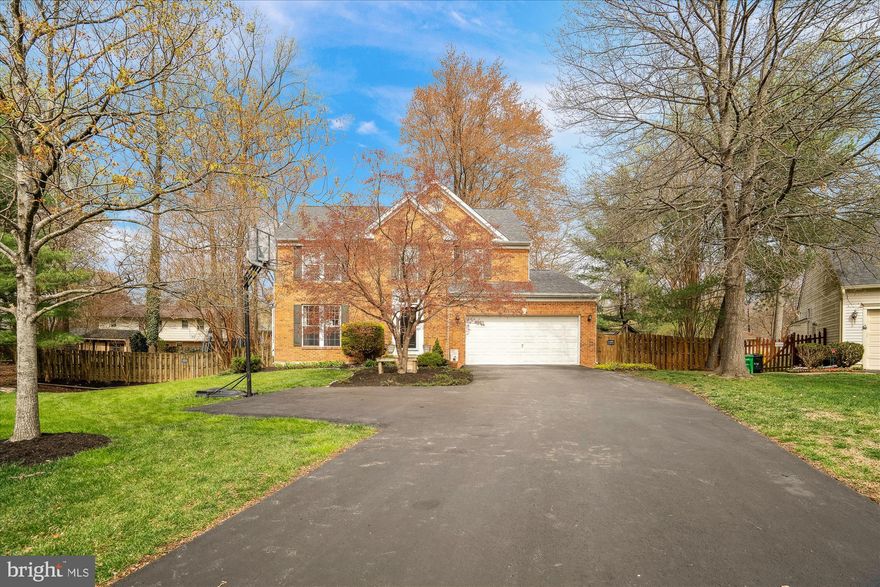 Beautifully remodeled home on a premium lot.  Hardwood floors.  Neutral paint.  Remodeled kitchen with granite counters and stainless steel appliances.   Family room off the kitchen with fireplace.  Separate dining room with bay windows and separate living room area.   Primary bedroom suite with remodeled bathroom and walk in closet.  Three other good size secondary bedrooms on upper level with hall bath with remodeling.  Fully finished  basement with rec room and large storage area.  Large maintenance free deck backing to a premium lot that is so pretty.  Make this home yours!