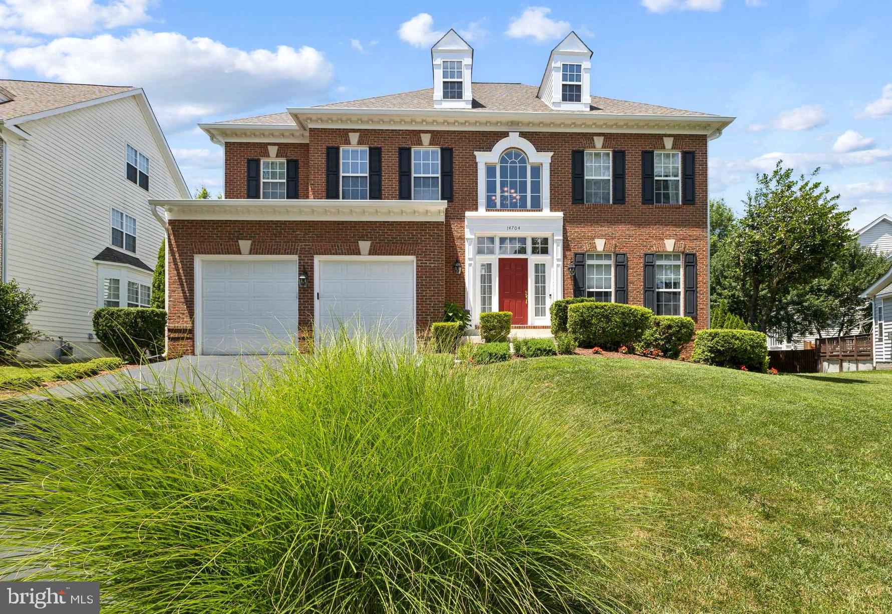 Welcome to this beautiful brick-front Colonial located in the prestigious Compton Chase community! Well maintained by its original owners, this elegant residence showcases true pride of ownership, thoughtfully updated with modern features and exceptional attention to detail. Situated on a premium lot with outstanding curb appeal, the home welcomes you with a grand two-story foyer and wide plank luxury vinyl flooring that flows throughout the main level. Designed for both everyday comfort and stylish entertaining, the main level offers a formal living and dining room, private home office or study, powder room, spacious family room, and a beautifully appointed kitchen. The sun-drenched family room features a stunning wall of windows and a cozy gas fireplace, creating a warm and inviting space for relaxation. The gourmet eat-in kitchen is a chef’s dream, equipped with brand new dark stainless steel appliances, a center island with gas cooktop, granite countertops, coffee station, and abundant cabinetry—plus seamless access to the composite deck, ideal for outdoor dining and entertaining. Upstairs, you’ll find five generously sized bedrooms, three full bathrooms, and a convenient laundry room with utility sink. The luxurious primary suite is a serene retreat with floor-to-ceiling windows, two walk-in closets, and a spa-inspired en-suite bath with double vanity, soaking tub, and walk-in shower. The finished lower level expands the home’s living space with a large recreation room, a fully equipped wet bar with sink and mini fridge, a bonus room perfect for a gym or guest space, and ample storage. Noteworthy upgrades include, Irrigation system, Main HVAC (2019), Water Heater (2019), Upper-level HVAC (2014), Roof (2017), and kitchen appliances (2024). This exceptional home is ideally located with quick access to 28, Dulles Toll Road, 66, commuter lots, VRE, Dulles Airport, Sweetwater Tavern, Bull Run Regional Park, and an abundance of nearby shopping and dining options. 3D Tour and Floorplans are available.