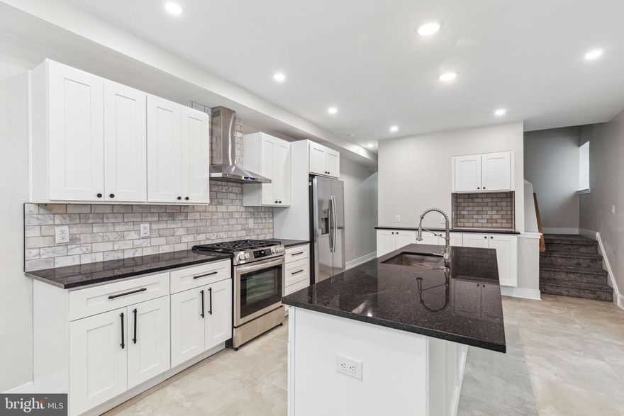 Experience luxurious living at its finest in the heart of Pennsport! Welcome to 1618 S 2nd Street, a meticulously renovated 3-bedroom, 3.5-bathroom end unit townhome that stands as a true masterpiece.

Upon arrival, you'll be greeted by a spacious living room featuring a built-in electric fireplace, seamlessly connecting to the gourmet kitchen. This kitchen is adorned with stainless steel appliances, white cabinets, a subway tile backsplash, and a sizable breakfast bar, complemented by a delightful coffee bar. Conveniently situated on the main level, you'll discover a washer and dryer, along with a half bath, offering utmost convenience for daily living.

Head downstairs to the finished basement, providing abundant storage options and serving as an ideal space for a home office, cozy den, or additional living area.

Venture up to the second floor to discover the primary suite, boasting remarkable closet space and a bathroom showcasing a dual vanity with plenty of storage and a spacious glass shower. Additionally, you'll find a versatile flex room, ideal for an office, nursery, or relaxing sitting area

On the third floor, you'll discover a beautiful deck and a spacious wet bar, perfect for entertaining. This level is also home to two additional bedrooms, each with its own ensuite, providing both comfort and privacy.

Just steps away from local favorites like Aroma on 3rd, Dolores, Federal Donuts, Herman’s Coffee, and Dickinson Square Park! Additionally, enjoy a short stroll to Target, Giant, Home Depot, and more. With easy access to bridges, I-95, and 676, this is the epitome of convenient city living.