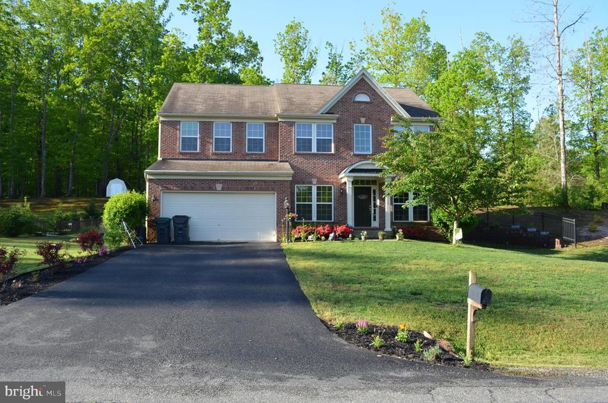 ****OFFER DEADLINE IS MONDAY AT 5PM****Beautiful colonial home in well sought after Stuarts Crossing community situated on 1.04 acres of land. This 4,090 sqt. ft. home boasts 4 bedrooms and 3.5 baths.  Sellers maintained property and prepared well for market- fresh paint and new carpet included. Property located on a not thru street, private pipe stem that backs to historic battlefield! Enter expansive and open main level and you may choose to enter the formal living room, office, kitchen, formal dining room or family room. Large gourmet kitchen with granite counters, double oven, oversized island and all newer, stainless steel appliances. Gorgeous sunroom adjacent to kitchen serves as a breakfast or basking area- buyer’s choices abound with this much space! Walk out from sunroom to rear patio. 9’ ceilings in family room off of kitchen offers additional comfort and ease of living with gas fireplace and stone accent. Main level completes with a half bath and office. Primary bedroom suite is huge with a sitting area, walk in closet and luxurious bath featuring separate soaking tub and double sinks. Second floor laundry room, 3 large bedrooms and another full bathroom complete the upper level. Finished lower level with built in surround sound in recreation room that walks out sliding glass door to rear exterior patio where you can enjoy summers under the pergola. Bonus room could be non-legal bedroom and lower level completes with full bath and ample storage space. backyard with pergola ready for entertaining. Smart home features include electric lock keypad for front door. Home includes whole home generator 2 HVAC units with dual heating and cooling zones are automated and remotely controlled. Annual septic inspections and maintenance, including septic pump February 2021. Reasonable $224 per quarter HOA fee includes trails, playground/ tot lot and tennis court for amenities. Convenient to groceries, 7-11 and Walgreens.