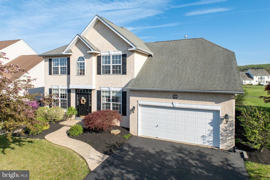 Welcome to this meticulously updated 3-bedroom home overlooking the 16th hole of the Bella Vista Golf Course. From the moment you enter the grand two-story foyer, you’ll be impressed by the elegant trim work, crown molding, wainscoting, and architectural archways. The foyer is flanked by a spacious dining room and living room, flowing into a stunning two-story family room filled with natural light, a ceiling fan, and a cozy gas fireplace and tinted windows.
The open-concept gourmet kitchen is ideal for entertaining, featuring 42” cherry cabinets, stainless steel appliances, deep sink, built-in microwave, and sliding glass doors leading to a large maintenance free deck and with golf course views. Step down to enjoy a patio with fire pit—perfect for relaxing evenings outdoors.
The main level includes a beautifully updated powder room, convenient deep laundry closet with washer/dryer and plenty of shelves for storage, and a spacious first-floor master suite with tray ceiling, large walk-in closet, and a show-stopping spa-like bathroom. Recently renovated, it boasts a deep walk-in shower with wood plank walls, double sinks with stone countertops, and built-in storage.
Upstairs, you’ll find two generously sized bedrooms, a full bath, brand new carpeting, fresh paint and a large loft overlooking the family room—easily convertible to a 4th bedroom.
The finished lower level is an entertainer’s dream with wood plank flooring, stone accent wall, custom bar with fridge, media space, game area, half bath, and a charming wine cellar with sliding barn doors and built-in shelving.
Lovingly maintained and thoughtfully updated, this home offers style, comfort, and unbeatable views—ready for its next owner to enjoy.