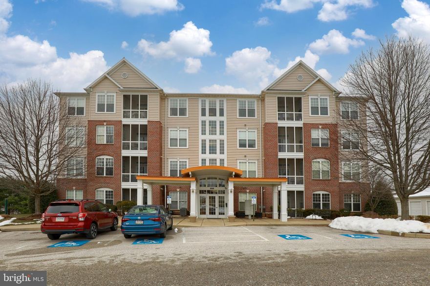 Well maintained, move-in ready top floor condo with elevator access in the secure 55+ community of Regents’ Glen! This condo features 2 bedrooms and 2 full bathrooms, 9’ ceilings, crown molding and hardwood floors. Open floor plan with bright eat-in kitchen with center island, recessed lights and dining area, and plenty of room to entertain with living room, dining room and family room.  Master bedroom with walk-in closet and private bathroom with walk-in shower and tile floors. Second bedroom, additional full bath with tub/shower combo and tile floors, and laundry room. Relax and enjoy the amazing views from the screened, private balcony.  New HVAC installed in 2020.  All appliances included.  Regents’ Glen offers many amenities including award winning golf course, driving range, swimming pool, fitness center and dining. Located within walking distance to York County Rail Trail and easy access to I83.