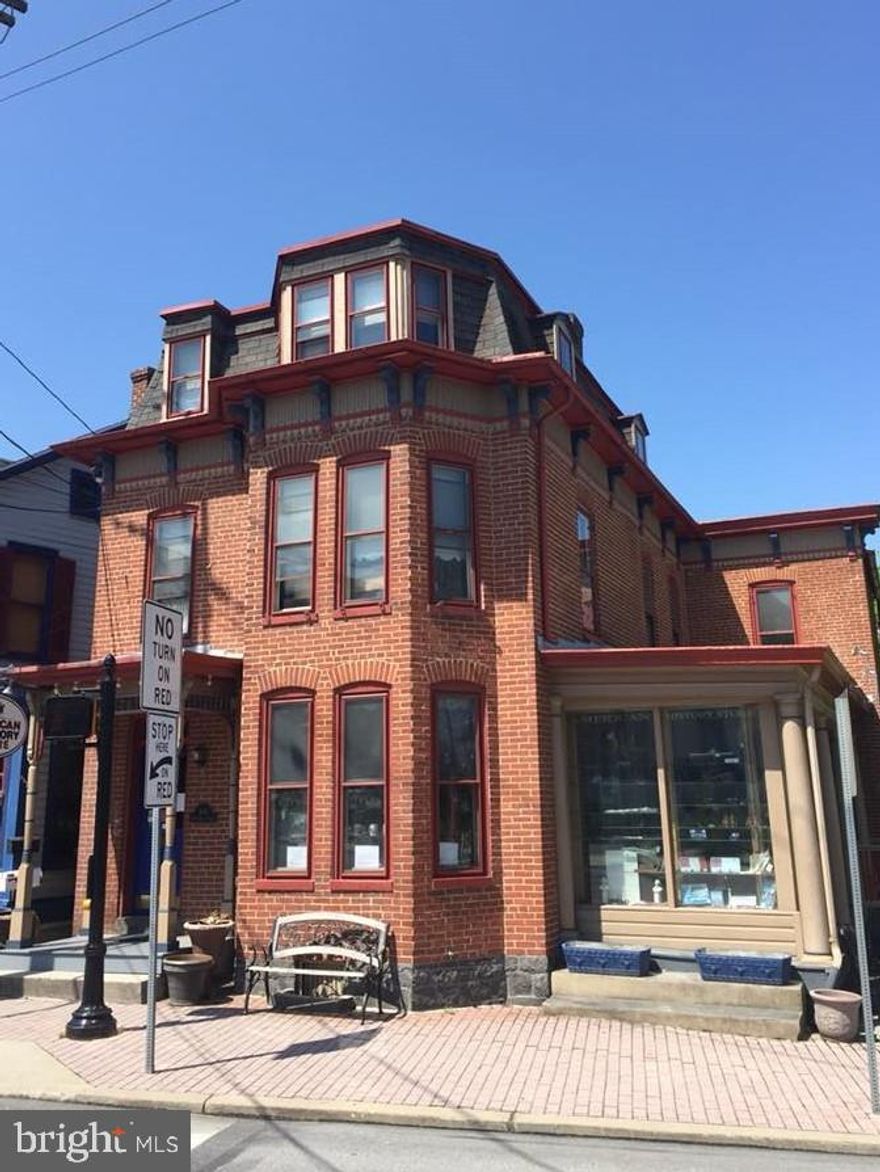 Own a piece of history in Gettysburg pa.  This one of kind building located on the corner of Baltimore street and Steinwher Avenue.  This wonderful brick commercial building offers so many opportunities from retail store to small restaurant to  whatever the entrepreneur  in you can create up.  If you ever dreamed of ownership in Gettysburg this is the chance.  This property has patios on the side and back to allow to do things outside.