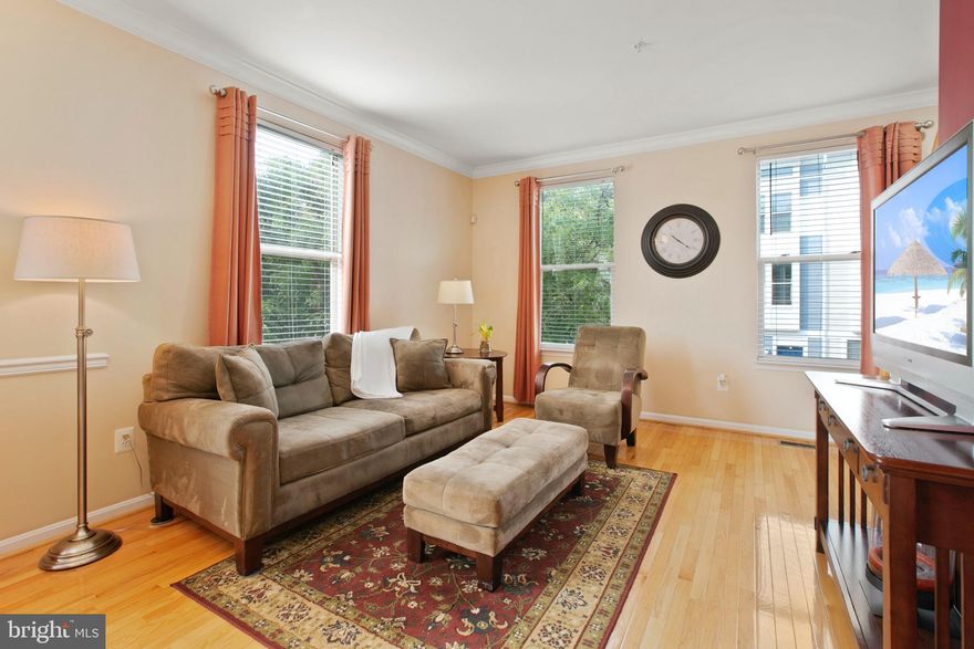 Welcome to 29 S Exeter, a prime Baltimore location! Pride of ownership shines in this end of group 2 bedroom, 2.5 bath home with an attached garage and parking pad. A cozy den welcomes you into the main level, the space is perfect for a home office, gym or second living space. The second level features open concept living with hardwood floors, crown molding and ample natural light. The level is centered around a well organized eat-in kitchen with custom cabinets and a breakfast bar that opens to a large living room. The level is completed with a half bath, sitting area and a deck. The third level includes a primary suite with an attached bathroom with a soaking tub, two large closets and a deck. The second bedroom has a large walk-in closet and the level is finished with a second full bath. Move right in and enjoy all Baltimore has to offer with walking distance to Harbor East, Little Italy, Fells Point and the Inner Harbor.