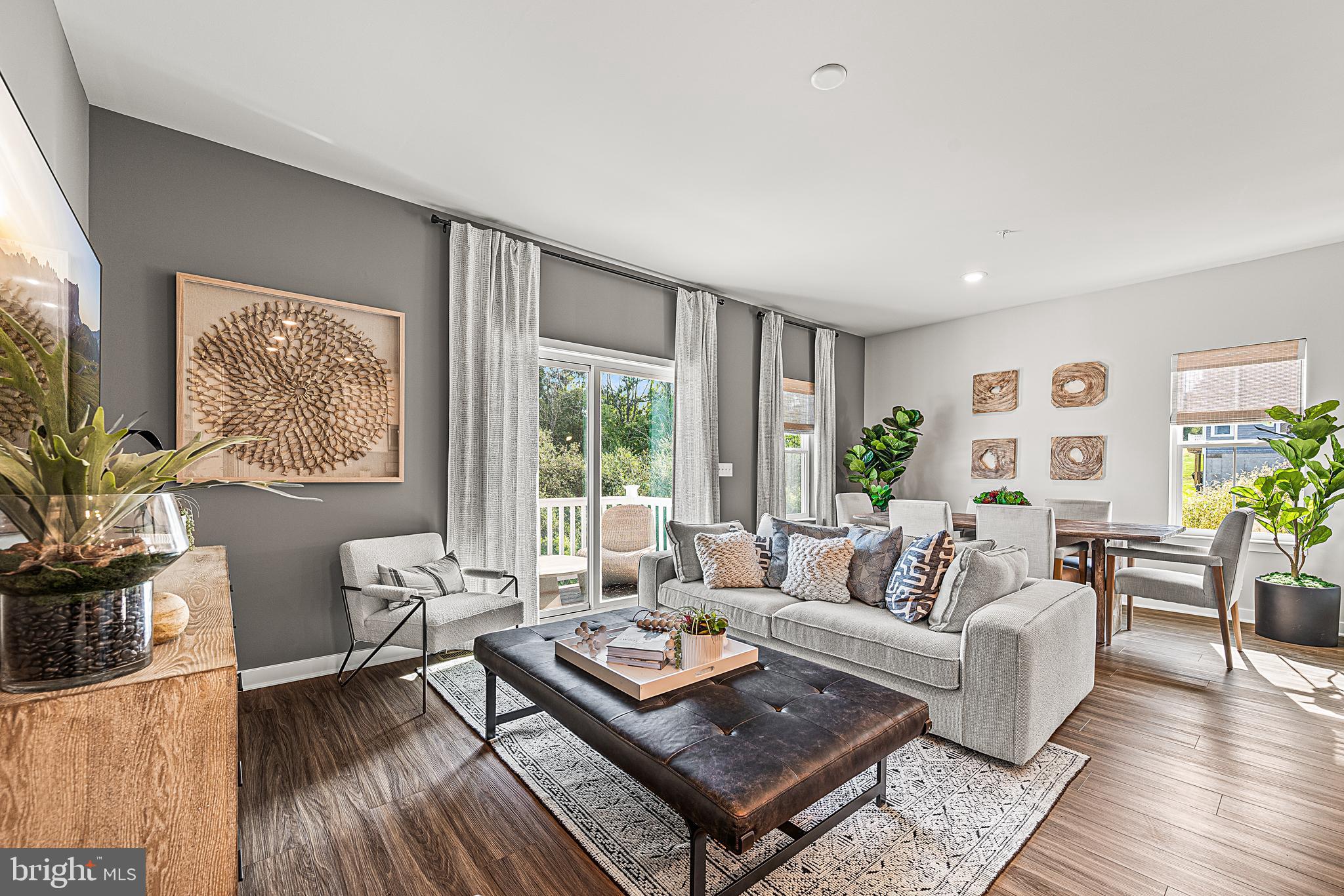 Now Available, the Brynley Model Home at Brookside Court! If you're looking for new construction without the typical wait time, this it it! 7596 Clayton Avenue at Brookside Court at Upper Saucon is located in the highly rated Southern Lehigh School District. This Brynley floorplan is a two-story home that features a modern, open-concept layout situated amongst the kitchen (complete with granite counters & white cabinets), dining room and Great Room with an attached 10x10 deck- perfect for seamless everyday living. Upstairs is a central loft area well-suited for a reading nook or home office space, surrounded by a spacious laundry room and two secondary bedrooms — each with a convenient closet. In a private corner, the primary suite showcases an adjoining bathroom and a large walk-in closet. Completing the home is a 1.5-car garage and large finished basement with half bath - perfect as an extended living space.
