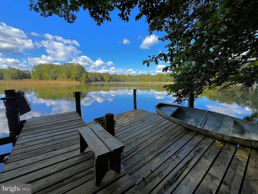 Lifestyle and Location Embrace a waterfront lifestyle at this 3-bedroom, 2.5-bath contemporary on Hunting Creek, close to Twirly Hole—known locally for rockfish, blue and channel catfish, and crabbing. Soaring Wood ceilings! Hardwood, ceramic tile, and luxury vinyl plank throughout create a cohesive, low-maintenance interior. The kitchen features Corian countertops, refreshed cabinetry, and white appliances. Two LED electric fireplace inserts elevate the ambiance, while the lower-level wine/coffee bar enhances day-to-day enjoyment.  The upper-level primary suite with a vanity/storage area, sports a newly tiled shower with barn-style door, and granite top double vanity.  Lower level 2 BR's 1 BA suitable for multi-generational living! Outdoor living shines, you can host on the large deck and then head down the lighted stairs to the private fishing dock with electric, water & boat lift. An oversized two-car garage provides ample storage. Fantastic location approximately 2 miles to Calvert Memorial Hospital, dining, and retail. A small fenced rear area for pets which are considered case-by-case. Short term lease option available.