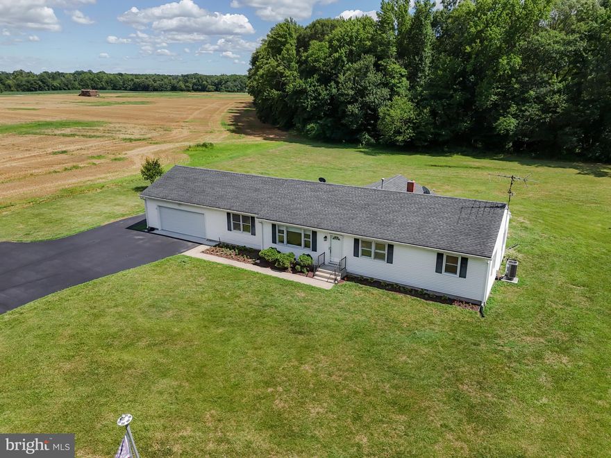 If you are looking at living in the country, on one level, plus a move in ready home, then look no further.  This 3 bedroom, 1 bath ranch sits on 2+/- acres and is bordered by farmland.  Recent updates include luxury vinyl flooring in the kitchen, utility room and mud room.  There is new carpet in the living room, den, hall and bedrooms.  There is new paint throughout the home.  New electric switches and plates throughout the home.  HVAC system (heat pump with propane backup) installed in August of 2022.  Simply Safe Security System that has the ability to record audio as well as video and currently monitors doors and some windows, however a subscription would be required.  New windows in the garage.  New fire rated door between garage and kitchen.  sealed and conditioned crawl space.  Talkie internet service with modem and router recently installed.  As you can see this really is "Move In Ready".