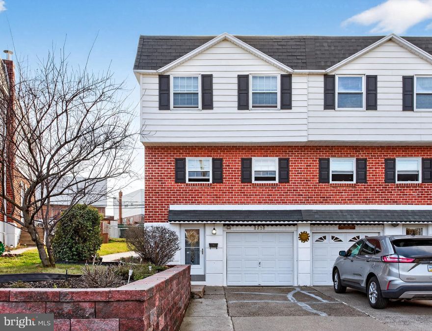 Welcome to 2720 Clayton Street, a 3-bedroom, 2.5-bath twin home located in the Pennypack neighborhood of Philadelphia. As you approach the home, a convenient two-car driveway and one-car garage provide ample parking. Inside, the living room features hardwood floors, crown molding, a ceiling fan with light, and a sliding door that opens to the covered porch and level fenced-in yard—perfect for relaxing or entertaining. Just beyond the living room is a convenient powder room. Past that, you have the 
dining room, which also offers hardwood floors, crown molding, chair rail detailing, and a ceiling fan with light. The kitchen features granite countertops, a peninsula with seating and pendant lighting, stainless steel appliances including a stainless steel range hood, and a ceiling fan with light. Upstairs,the primary bedroom features hardwood floors and a ceiling fan with light, along with a private en-suite bathroom with tile flooring and a step-in shower. The second level includes two additional bedrooms—one with carpeting and one with hardwood flooring—ideal for children, guests, or a home office. A full hall bathroom includes a tub/shower combination. The lower level expands the living space with a family room featuring tile floors and sconce lighting. This level also includes a laundry area with washer and dryer and a door to the driveway. Conveniently located near local shopping, grocery stores, restaurants, and more, this home also offers easy access to Route 1 and I-95 for an easy commute. Don’t miss the opportunity to make 2720 Clayton Street your new home.