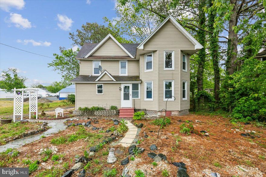 Welcome to this charming home in the heart of Crisfield — originally built in 1893 and ready for its next chapter. Featuring 4 bedrooms, 2 full baths, two separate living spaces, a dining room, kitchen, and 2 porches, this home offers plenty of room to spread out while still feeling warm and inviting. You’ll fall in love with all the character and unique quirks that only a home of this age can offer — from its timeless charm to the stories and memories waiting to be made here. Over the years, many important updates have already been completed, including windows, doors, and vinyl siding replaced within the last 15 years, along with most electrical and plumbing updates completed within the last 8 years. One upstairs bedroom even features a cozy electric fireplace for an extra touch of comfort. Outside, you’ll find a detached garage perfect for storing lawn equipment, outdoor toys, or creating your own workshop space. Connected to city water and sewer for added convenience. Being sold as-is, this home is full of opportunity for someone ready to make it their own and bring new life to a piece of Crisfield history.