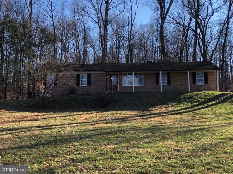 THIS BEAUTIFUL HOME IS SET ATOP A HILL ON  1.76  QUIET AND PEACEFUL-PARK-LIKE ACRES.  UP THE LONG DRIVEWAY AWAY FROM THE ROAD-IT'S PERFECT FOR THE OUTDOOR ENTHUSIAST-BACKS TO WOODS AND MATURE TREES.  **PRICED TO SELL**THIS HOME SHOWS GREAT AND IS SURE TO PLEASE!  MOVE-IN-READY WITH NEW DESIGNER KITCHEN AND GRANITE TOPS AND NEVER BEEN USED ENERGY STAR APPLIANCES.  NEW FLOORING-DOORS AND TRIM THROUGHOUT.  FRESH CUSTOM PAINTS.  BRAND NEW GUTTERS AND NEWER ROOF AND WINDOWS.  FULLY FINISHED BASEMENT WITH WELLED EXIT.  OVERSIZED 2 CAR SIDE LOAD GARAGE AND REAR DECK.  NO HOA. SEPTIC AND WATER QUALITY PASSED INSPECTION. 
 READY FOR A NEW OWNER-EASY TRANSACTION-EVERYTHING HAS BEEN SERVICED. CLOSE TO COMMUTER ROUTES AND ALL THE RESTAURANTS AND SHOPPING MOUNT AIRY HAS TO OFFER. EXCELLENT ALTERNATIVE TO MONTGOMERY COUNTY PRICES.