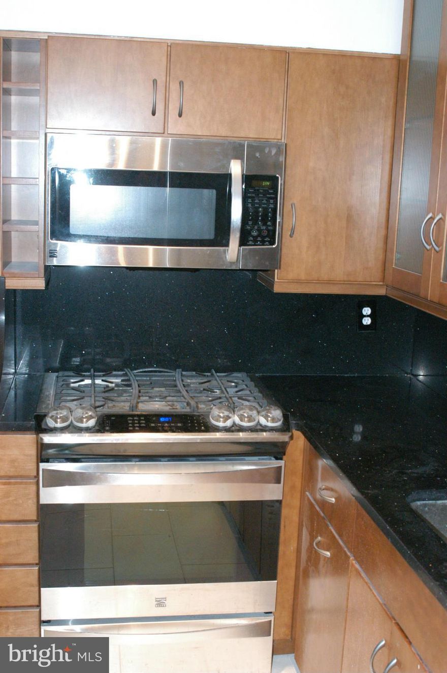 Renovated condo in desirable Mosby Woods. Terrific location on Rt50 with easy access to Vienna Metro, shopping, & entertainment.  Fully re-painted, modern kitchen w/ high end appliances,. New doors, carpets, windows & SGD. Includes portable in-unit W/D as-is. Large storage unit. Condo fees include all utilities except electricity. Fairfax HS pyramid. Great starter home in active community w/pool!